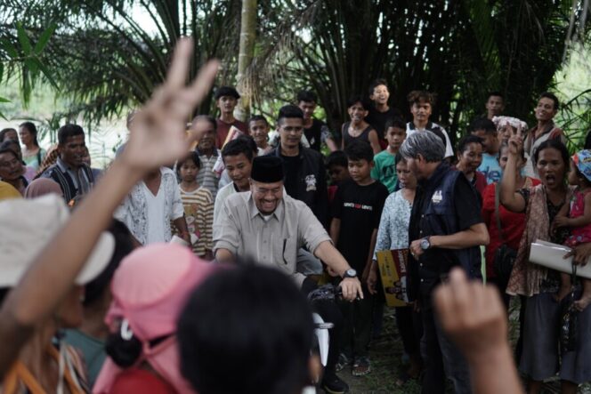 
 Naik Sepeda Motor Warga, Baharuddin – Syafrizal Tinjau Aliran Sungai Dalu – dalu